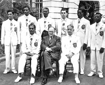 (Left to right) Standing: Mannie Ramjohn, Wilfred Tull, Albert Browne (Coach), Compton Gonsalves, George Lewis, Rodney Wilkes  Sitting: Laurie Rogers (Official), Sir Arthur Creech-Jones (British Secretary of State for the Colonies), Errol Knowles (Manager)
